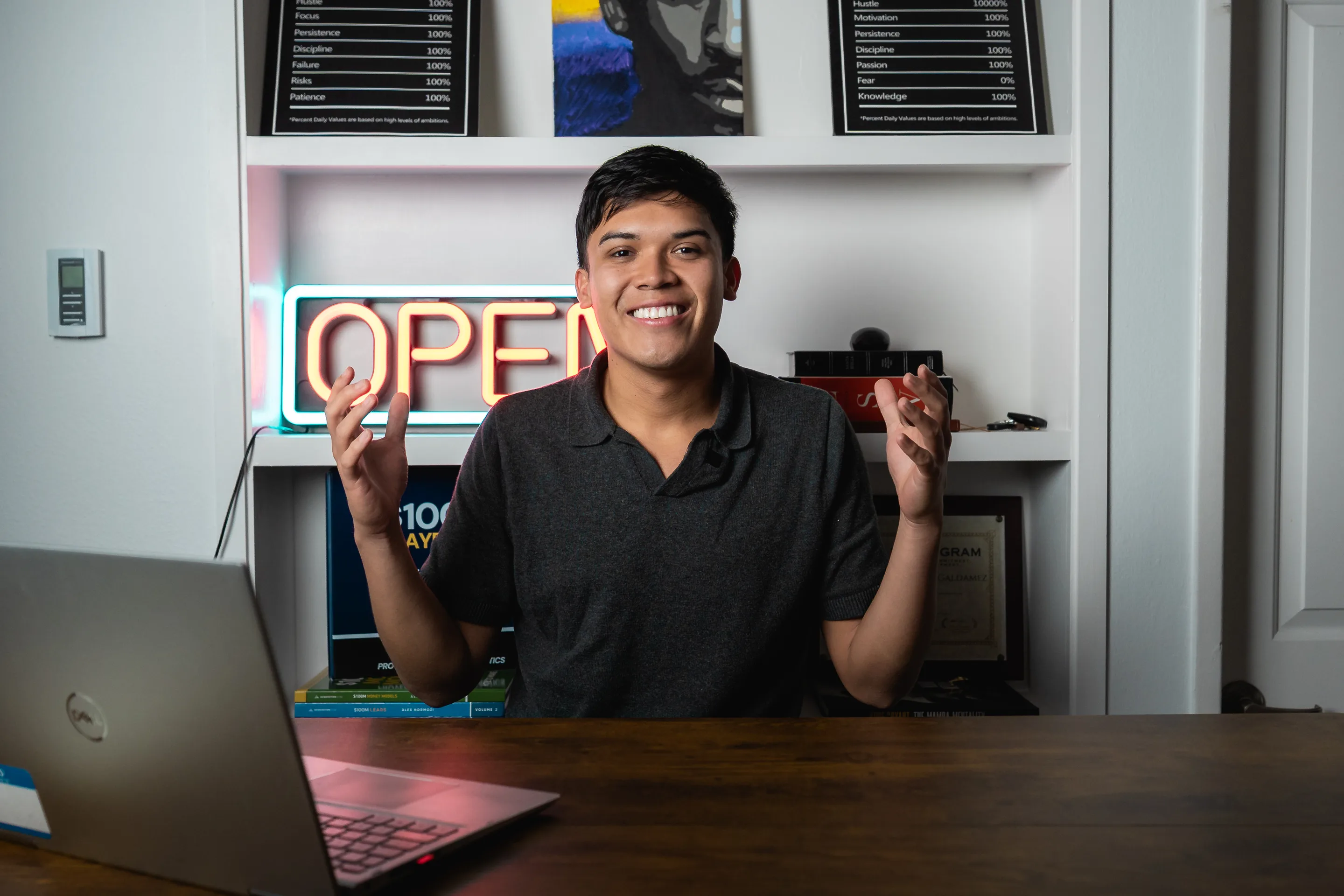 Eliam Fuentes smiling at his desk