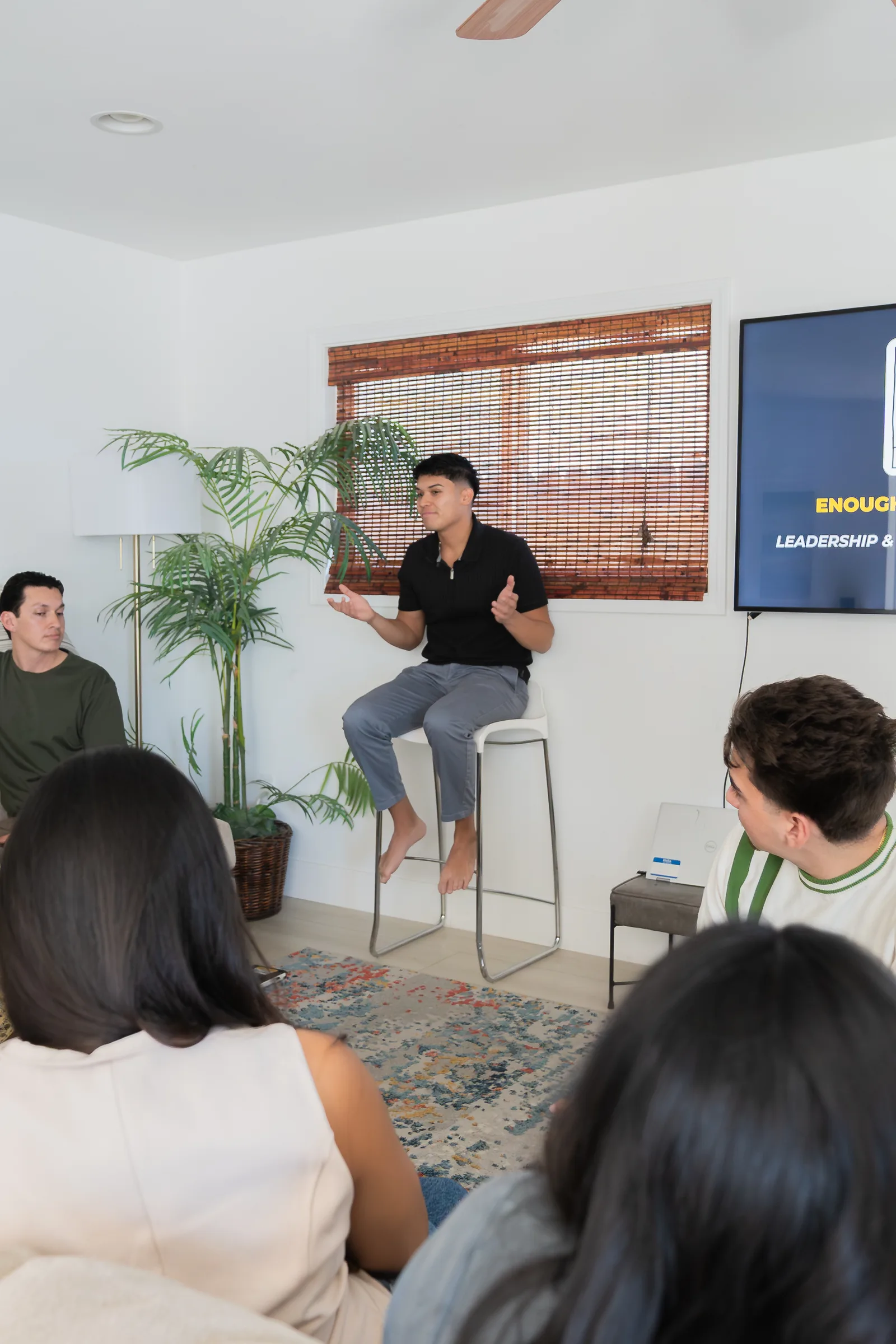 Eliam Fuentes teaching Enough Is Enough to a seated group
