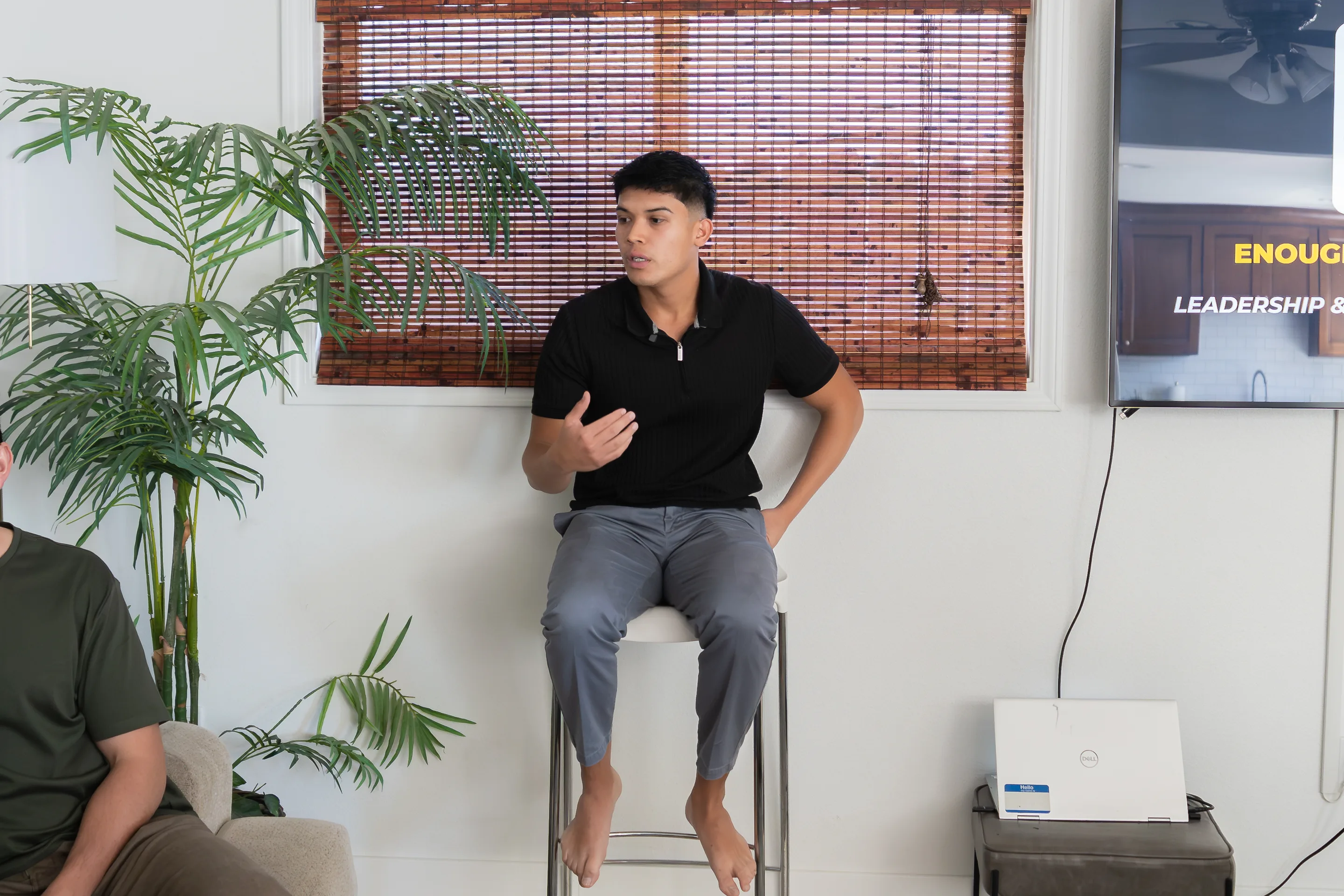 Eliam Fuentes teaching a leadership session from a stool